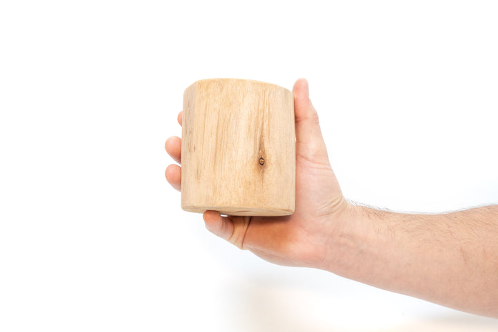 hand holding driftwood container