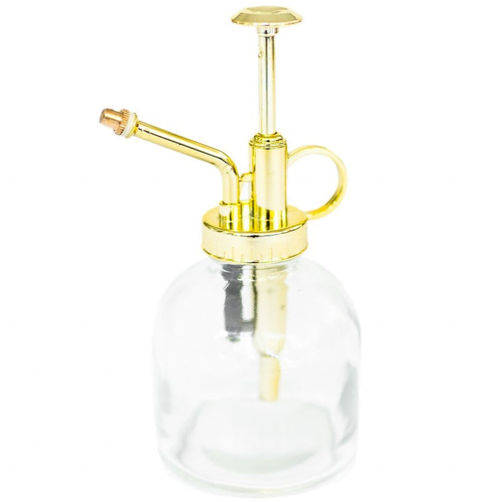 glass mister with gold colored spray nozzle