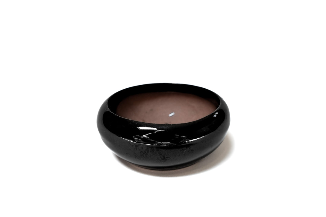 black glazed terracotta dish