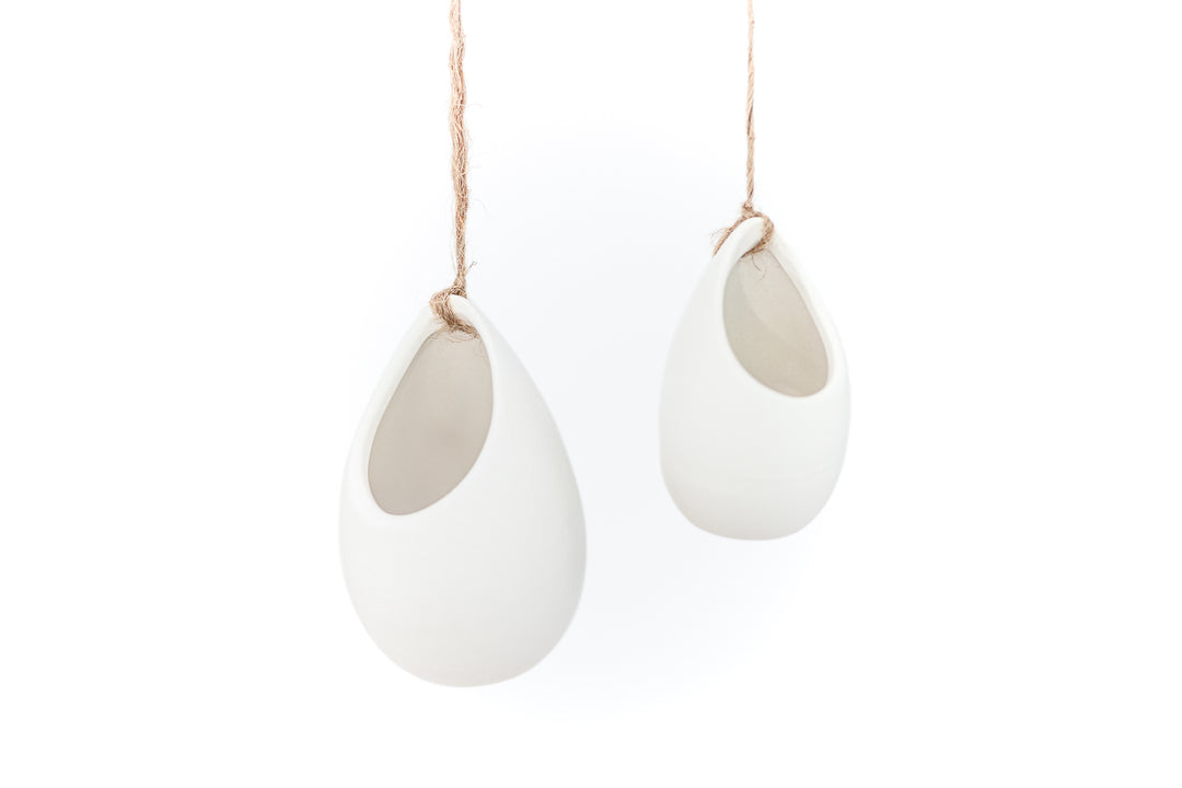 2 large ivory ceramic vases hanging from hemp string