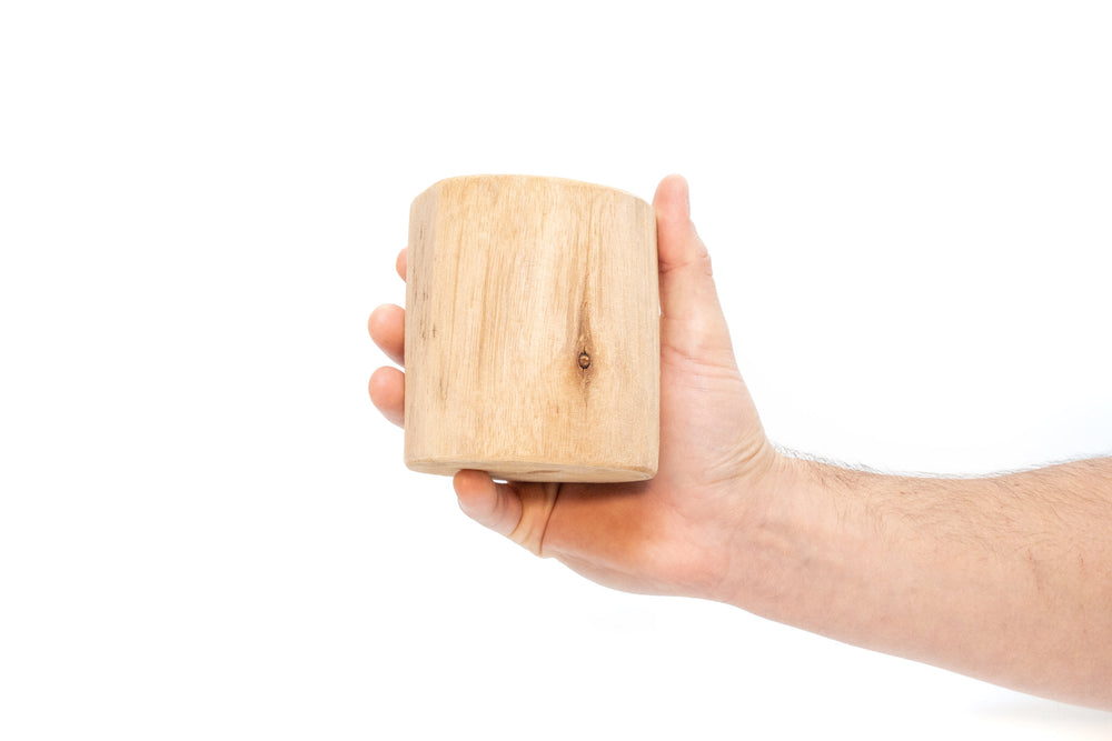 hand holding driftwood container
